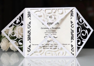 Laser cut white pearl wedding invitation with delicate hollow floral pattern and insert