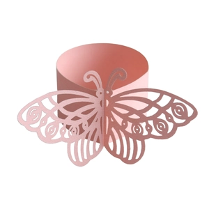 Macro detail of pink laser-cut butterfly napkin ring with delicate hollow wings texture