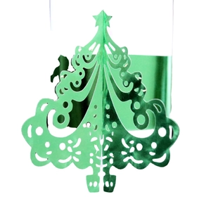 Green laser-cut Christmas tree napkin rings with hollow star pattern for festive table decor