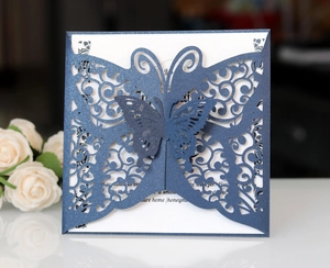 Laser cut navy blue glitter butterfly wedding invitation card with elegant floral lace design