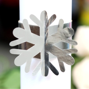 Silver snowflake napkin ring holder with a polished mirror finish for festive dining decor
