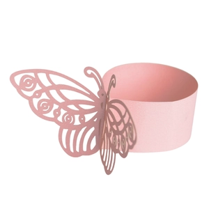 Detailed laser-cut pink paper napkin ring with intricate butterfly design for weddings