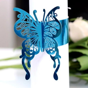 Laser-cut butterfly napkin ring in metallic blue finish for elegant wedding table decor