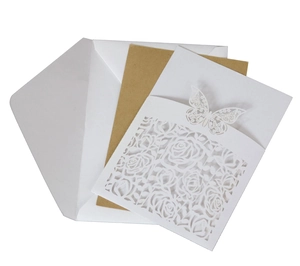 Detailed set of laser-cut butterfly lace invitation with white cover and kraft insert