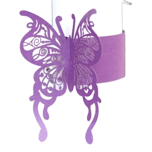 Laser cut purple butterfly napkin ring with intricate floral patterns for table decor