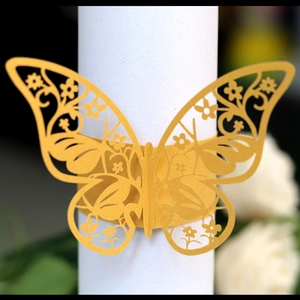 Elegant gold butterfly laser-cut napkin rings for wedding and banquet table decor