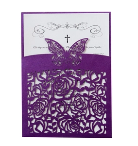 Detail of laser-cut purple butterfly and rose wedding invitation with biblical verse