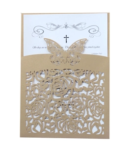 Golden laser-cut wedding invitation featuring butterfly and floral hollow patterns