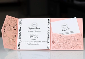 Detail of pink laser-cut sunflower wedding invitation set with RSVP and info card