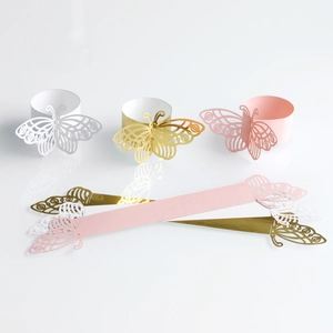 Detailed laser-cut hollow butterfly paper napkin rings in white gold and pink colors