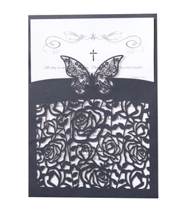 Laser-cut wedding invitation featuring intricate black rose and butterfly hollow patterns