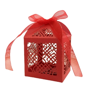 Red laser-cut hollow gift box with intricate heart pattern and matching organza ribbon bow