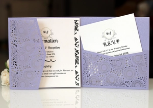 Detailed laser-cut lavender wedding invitation set with floral cover and RSVP cards