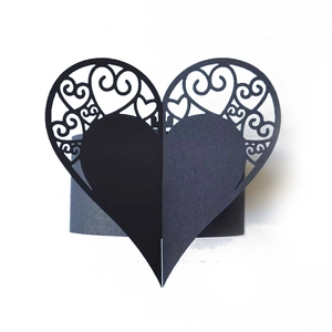 Detailed laser-cut heart napkin ring in black paper for wedding and party table decor