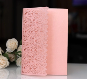 Elegant pink laser cut folding invitation card with intricate floral patterns for weddings