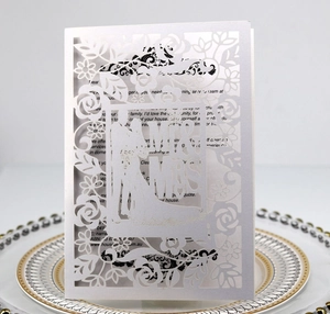 Laser cut wedding invitation with white rose pattern and Mr & Mrs silhouette