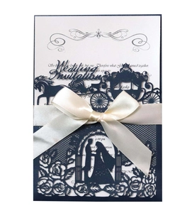 Elegant laser cut wedding invitation with navy blue hollow shell and white satin bow