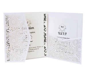 Elegant white laser cut floral wedding invitation set with RSVP cards on a clean background