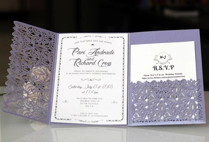 Detailed laser-cut lavender wedding invitation set with elegant floral hollow patterns