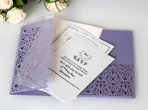 Detail of lavender laser cut vine hollow cover with white cardstock wedding invitation