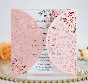 Detailed laser-cut hollow pink floral wedding invitation with elegant printed inner card