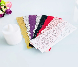 Detailed laser-cut rose hollow paper candle wraps in multiple vibrant colors for events