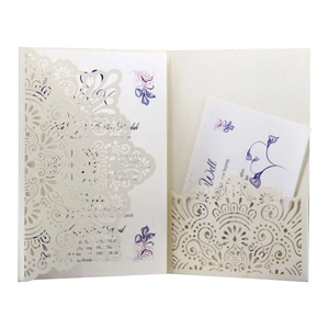 Detailed laser-cut mandala pattern on cream wedding invitation sleeve with inner card