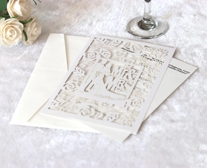 Laser cut wedding invitation set with cream Mr & Mrs silhouette and floral pattern