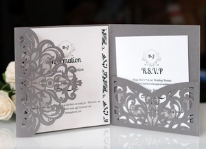 Detail of laser-cut floral grey invitation sleeve with RSVP card and elegant roses