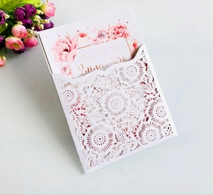 Macro detail of laser-cut sunflower pattern invitation with floral inner card