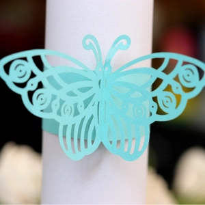 Laser cut butterfly paper napkin ring in turquoise blue for wedding table decor
