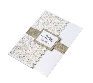 Detail showing white laser cut lace floral patterns and golden glitter belly band for wedding