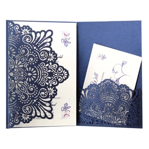 Navy blue laser cut wedding invitation set with floral hollow sleeve and pearl paper