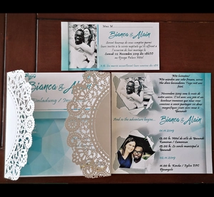 Detail view of laser cut wedding invitation with custom photo and floral patterns
