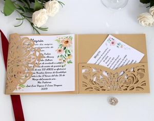 Detailed laser-cut floral invitation set with gold pocket sleeve and elegant rose decor