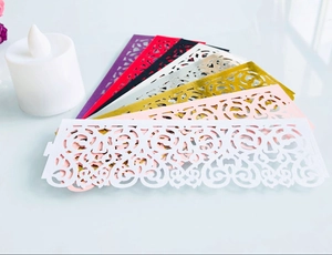 Laser-cut hollow decorative paper wraps for LED tea light candles in multiple vibrant colors