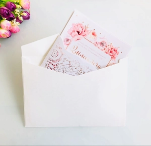 Detailed laser cut burgundy invitation card with floral insert and premium envelope