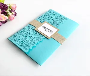 Close-up of laser-cut hollow card holder in tiffany blue with golden glitter band