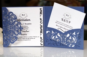 Detailed laser cut lace design on navy blue wedding invitation with RSVP card set