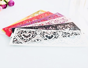 Detail of laser-cut hollow heart pattern paper sleeves for LED tea light candles