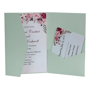 Detail view of sage green laser cut invitation pocket with floral RSVP card set