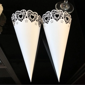 White laser-cut heart pattern paper flower cones for wedding petal confetti and DIY decor