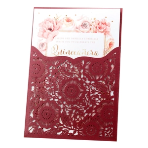 Laser cut burgundy wedding invitation with elegant floral pocket and white inner card