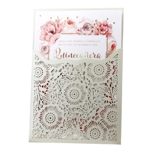 Detail of laser-cut floral wedding invitation with watercolor flower inner card
