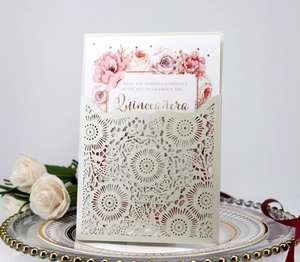 Detail of laser-cut pocket and floral inner card for elegant wedding or Quinceañera