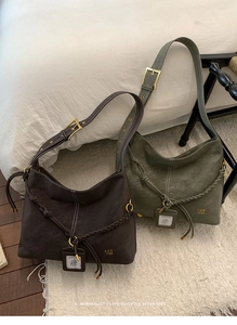 Detailed view of matte retro hobo bags in coffee and olive green with decorative knots