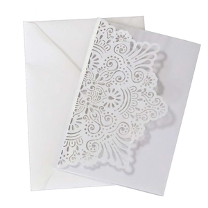 Laser cut ivory wedding invitations set with floral hollow pattern and white envelopes