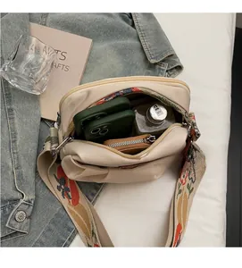 Interior view of beige crossbody bag showing spacious capacity for phone and wallet