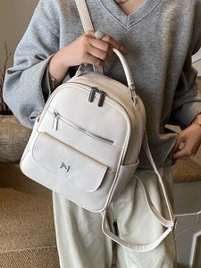 Compact white pebble leather backpack for women with metal logo and versatile straps