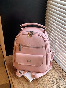 Pink lychee texture faux leather backpack with silver logo and multiple zip pockets